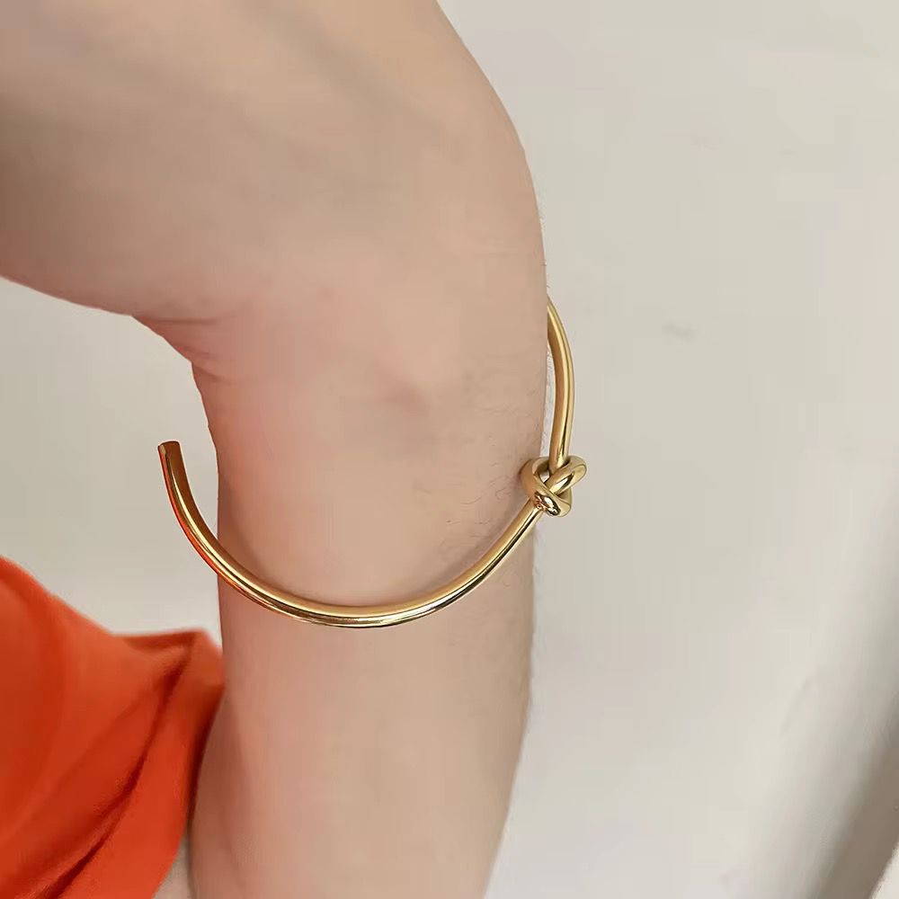 Elegant gold-plated knot design bangle and ring set
