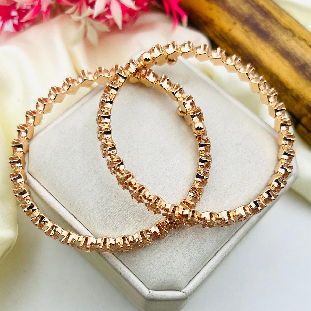 Elegant adjustable bangle with sleek non-tarnish finish, fits all wrist sizes.