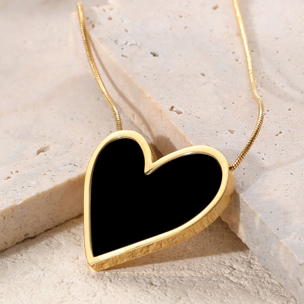 Trendy black heart-shaped necklace , premium fashion accessory.