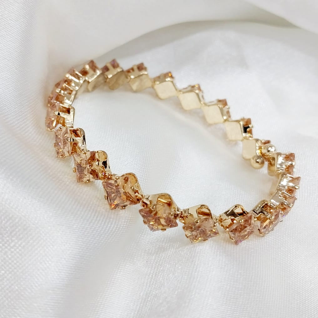 Elegant Peach Gemstone Bracelet with soft peach-colored gemstones set in gold-tone links, displayed on a silky white fabric. The bracelet is adjustable, waterproof, and part of a 70% off promotion. Its refined, warm tones make it a versatile and stunning accessory.