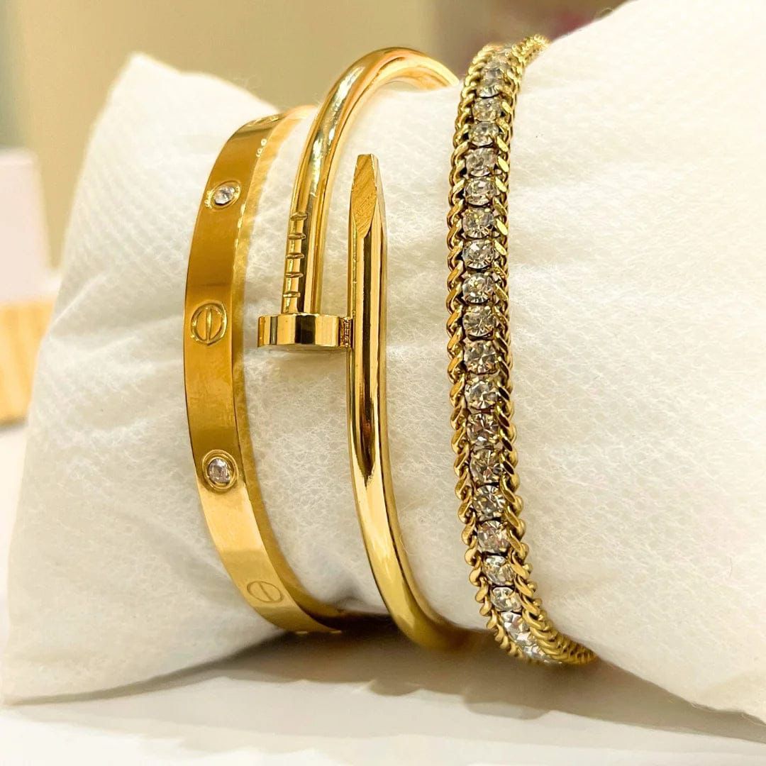 โGold bracelet stack โ screw, nail, and crystal tennis bangles luxury jewelryโ