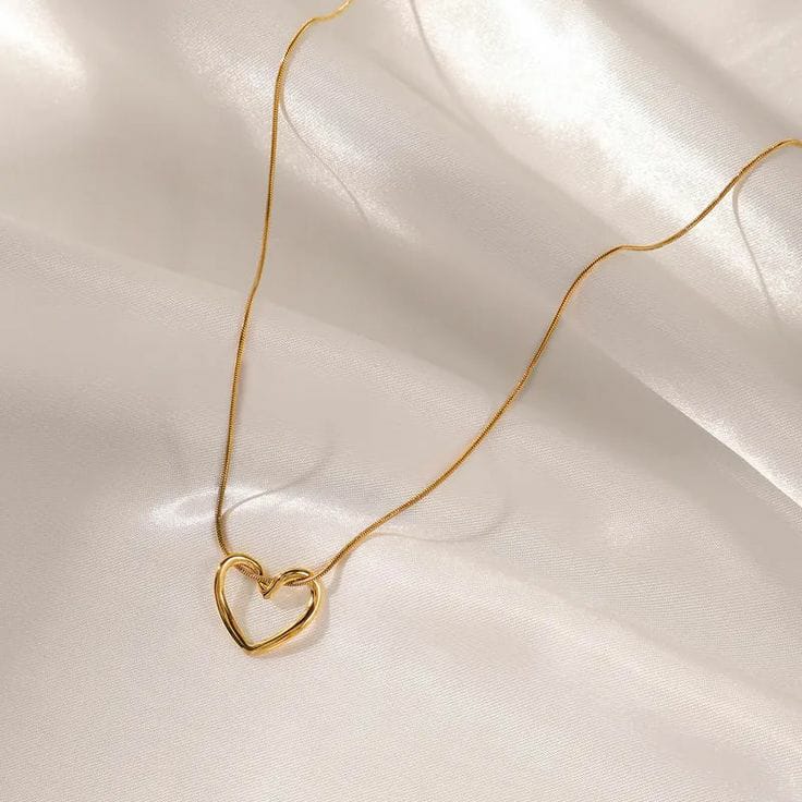 Open heart pendant necklace on gold chain, minimalist jewelry for women.