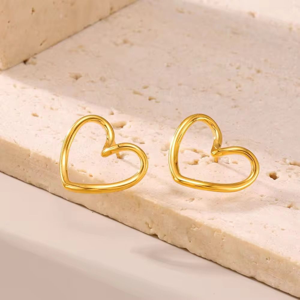 Lightweight gold outline heart earrings, minimalist design