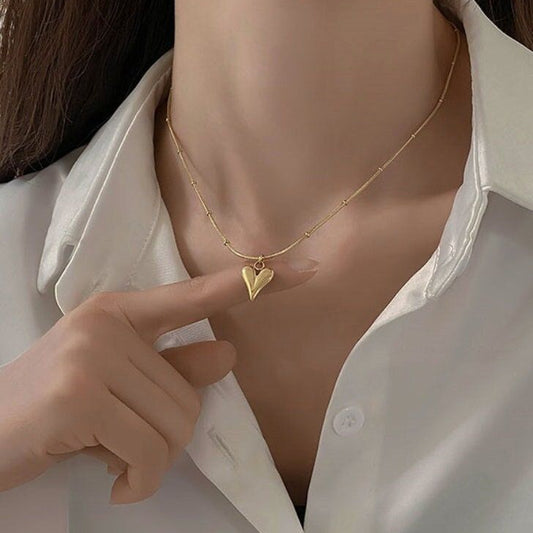 Puffy heart gold necklace on model – waterproof stainless steel jewelry for women