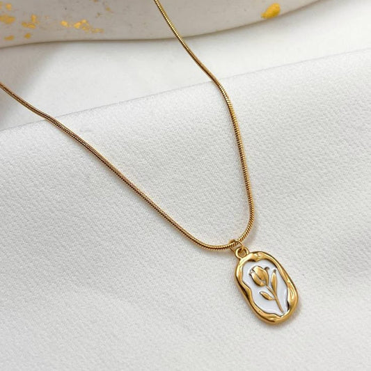 Stylish gold charm necklace with white tulip design