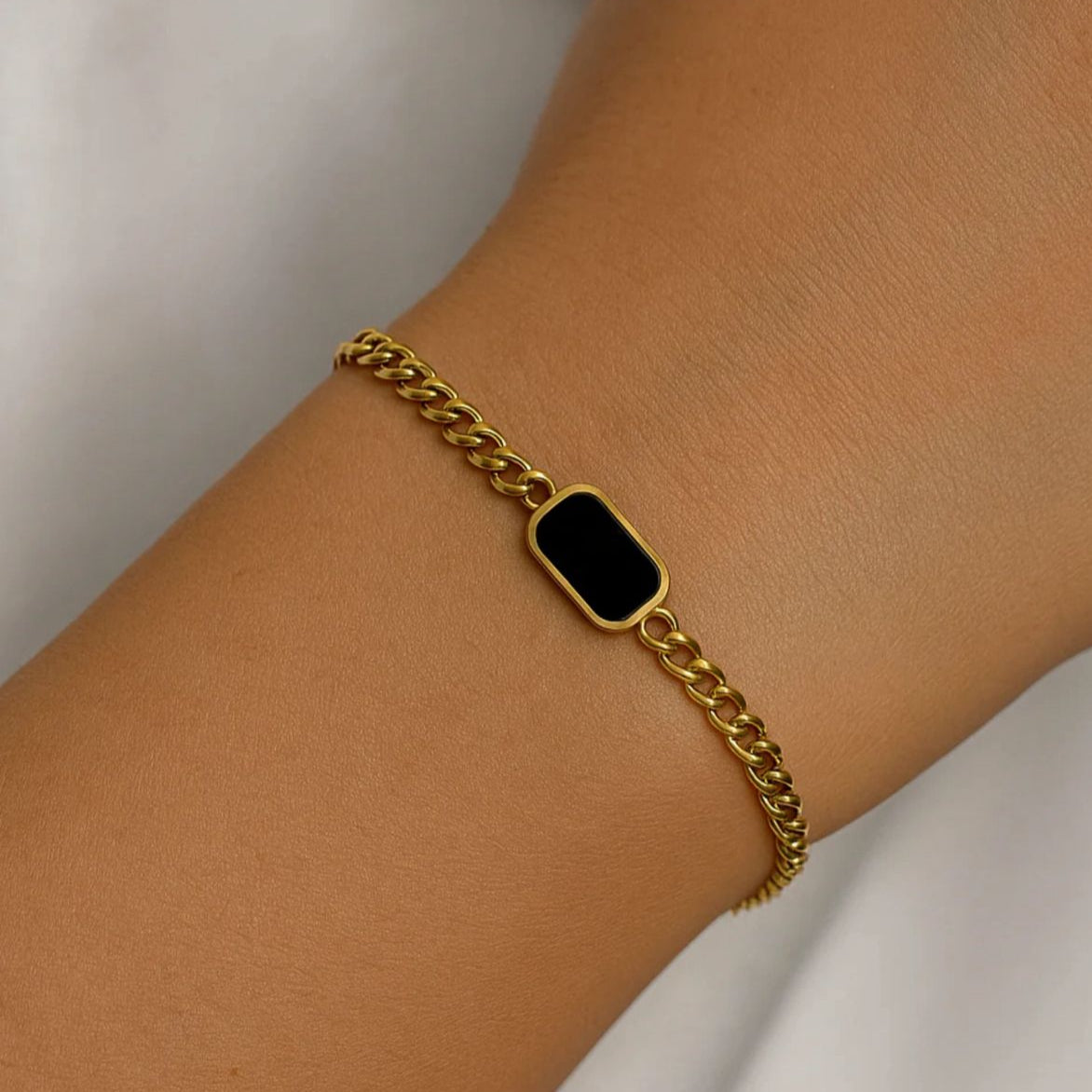 Luxury gold chain bracelet with black centerpiece