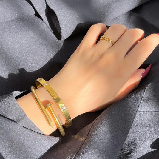Trendy Cartier cuff bracelet with screw nail design, fashion jewelry set.