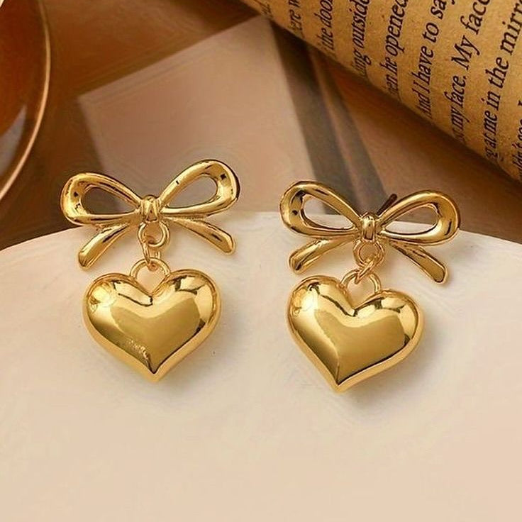 Lightweight gold earrings with cute bow and dangling heart