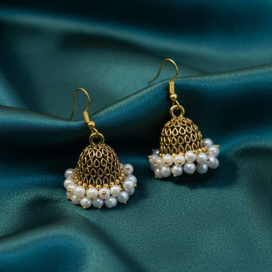 The earrings feature a dome with a filigree mesh pattern and a full, hanging fringe of small, polished white faux-pearl beads attached to the bottom rim.
