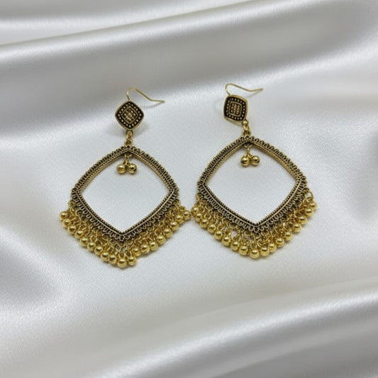 The earrings feature a delicate pattern on the frame and are accented with a fringe of small gold-tone bead charms dangling from the bottom.