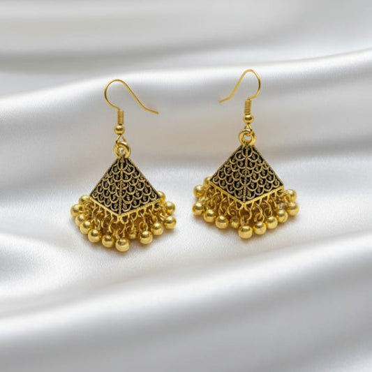 A pair of antique gold and black pyramid-shaped Jhumka earrings
