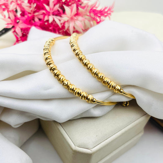 Fashion jewelry adjustable bangle with polished non-fade design.