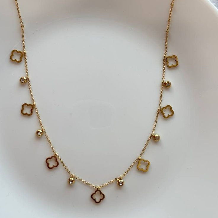 Gold clover charm necklace with crystal accents, waterproof stainless steel delicate jewelry