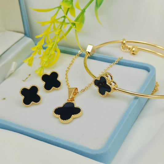 Black clover gold jewelry set with necklace, earrings, and adjustable bangle