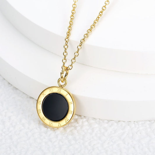 Elegant gold chain with round black stone pendant