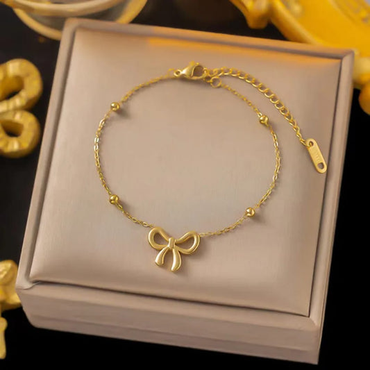 “Luxury gold bow bracelet – hypoallergenic and adjustable jewelry”
