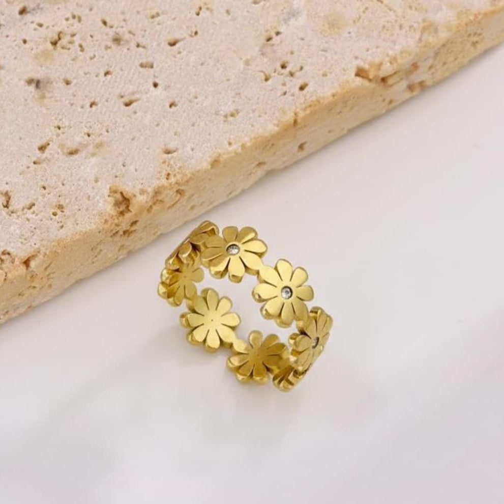 : Gold floral waterproof ring with crystal center