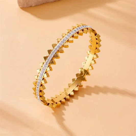 Elegant women’s gold bangle featuring spiked design and waterproof finish