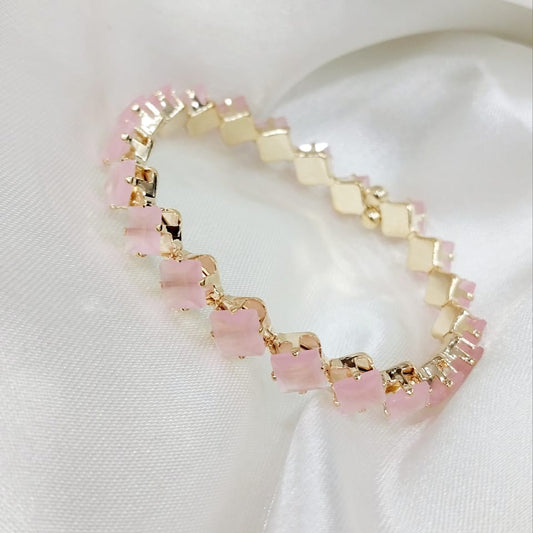 Elegant Rose Quartz Bracelet with soft pink gemstones set in gold-tone links, displayed on a silky white fabric. The bracelet is adjustable, waterproof, and part of a 70% off promotion. Its gentle, feminine design makes it a perfect accessory for any occasion
