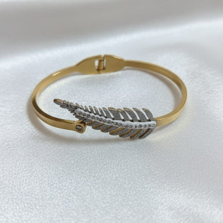 Gold and silver leaf design bangle bracelet on white satin background – waterproof jewelry, 70% off