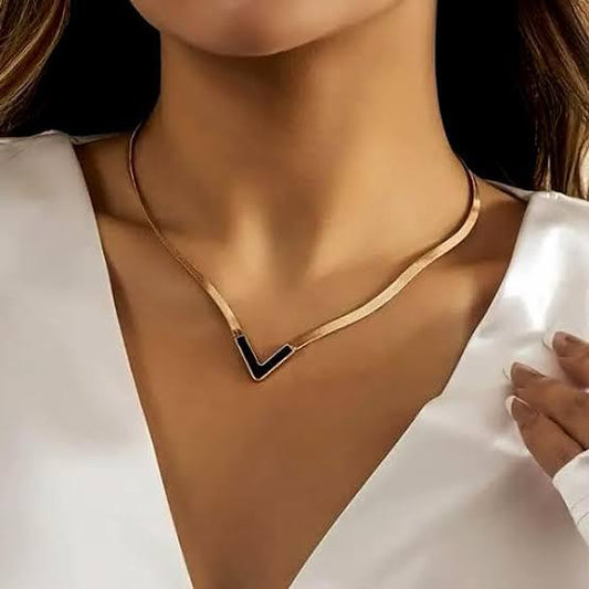 Gold V-shaped necklace with black enamel accent