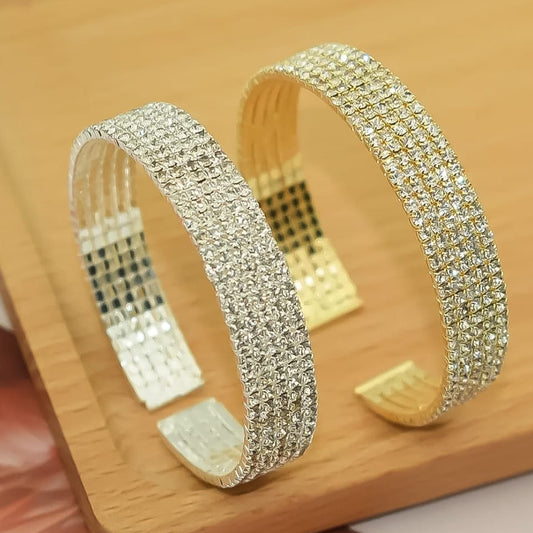 “Sparkling gold and silver cuff bracelet pair – high-shine stainless steel jewelry”