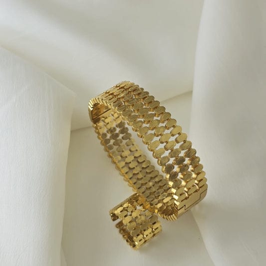 Luxury waterproof gold mesh cuff bracelet on white fabric background