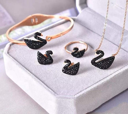 Shop the Ibraj Swan Crystal Jewellery Set featuring a premium rose-gold finish and black crystal swan design. Complete 4-piece luxury set now at 70% OFF. Limited stock available.