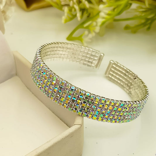 “Wide silver bangle with Aurora Borealis crystals – elegant party wear bracelet”