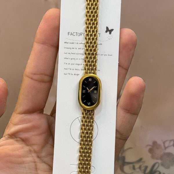 “Luxury gold mesh strap women’s watch with black oval dial”