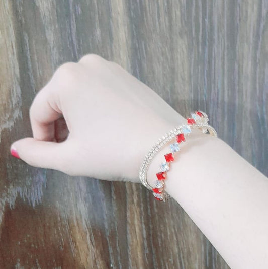 Elegant waterproof gold bracelet with bow and red crystal details