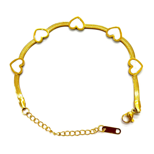 Luxury gold bracelet with white enamel heart charms – elegant everyday accessory