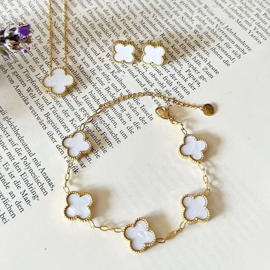 Elegant white enamel clover bracelet, pendant, and stud earrings