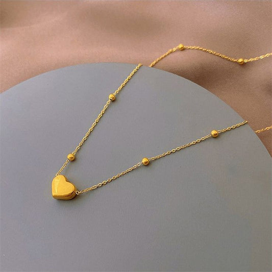 Minimalist heart necklace , timeless jewelry look.