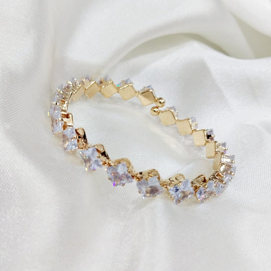 Gold bracelet with square-cut clear stones